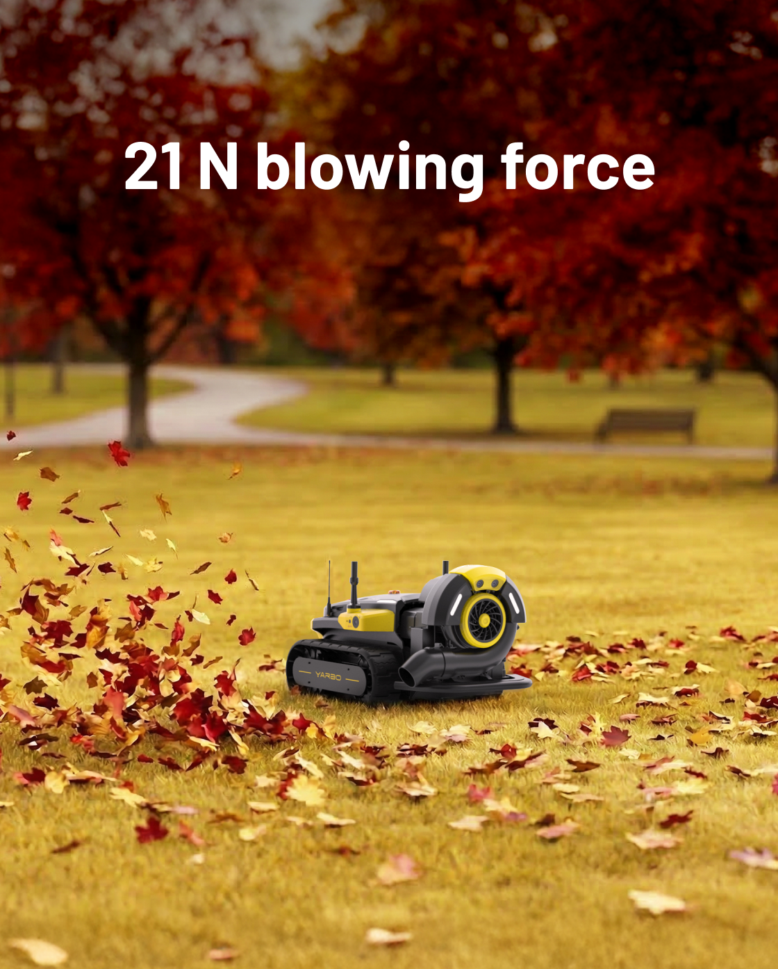 Yellow and black robotic leaf blower by Yarbo on grass, blowing autumn leaves in park setting