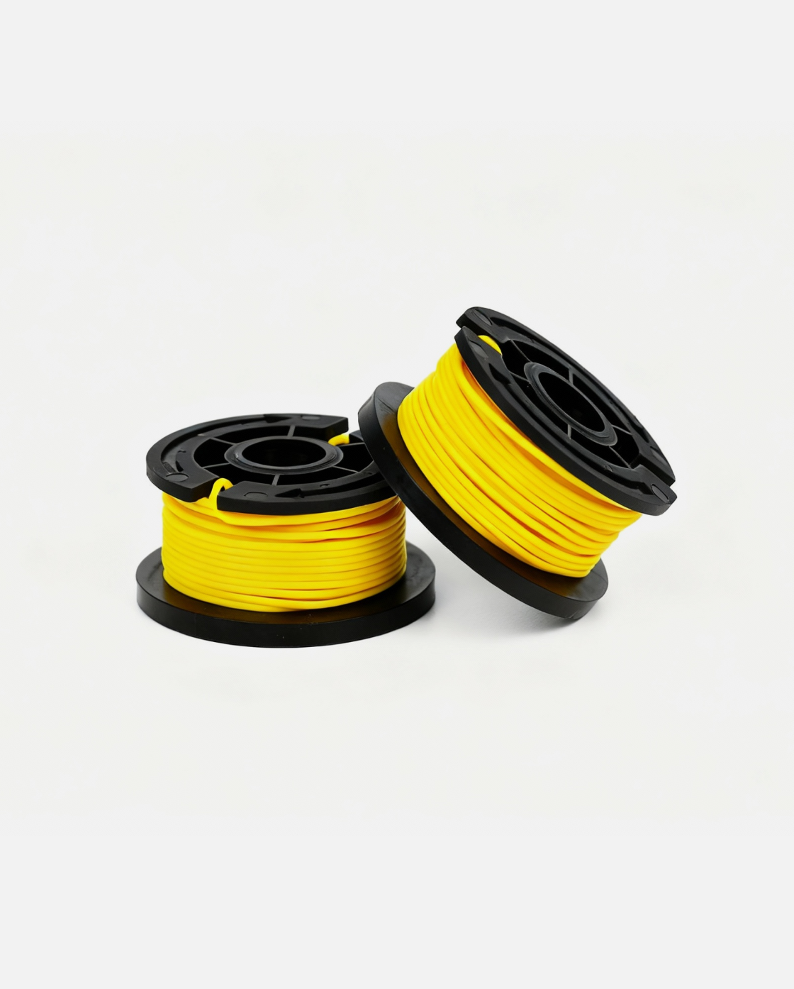 Yellow trimmer line spool with black plastic housing, two units shown side by side on white background