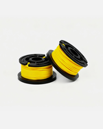 Yellow trimmer line spool with black plastic housing, two units shown side by side on white background