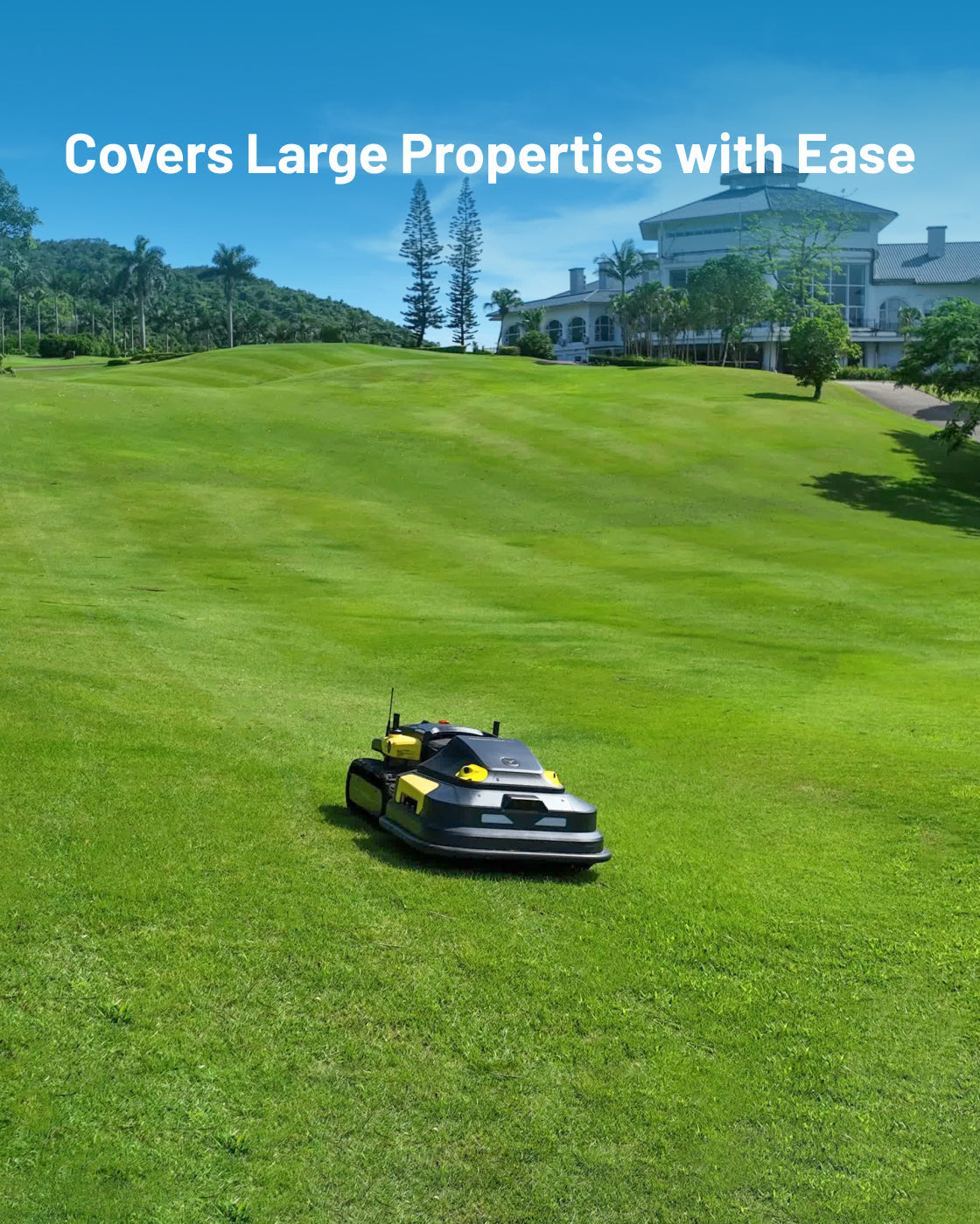 Robotic lawn mower with black and yellow body by Yarbo, shown on expansive green lawn in front of large house, side view.