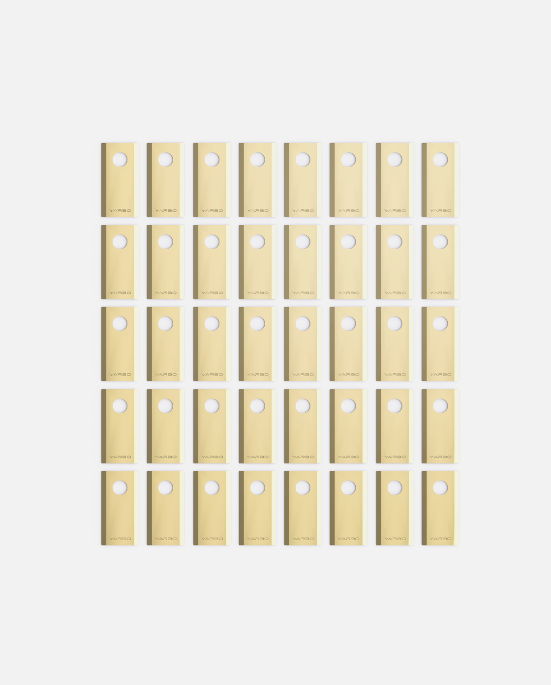 40-piece set of beige YARBO cutting blades with circular holes, arranged in grid pattern, front view