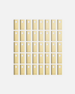 40-piece set of beige YARBO cutting blades with circular holes, arranged in grid pattern, front view