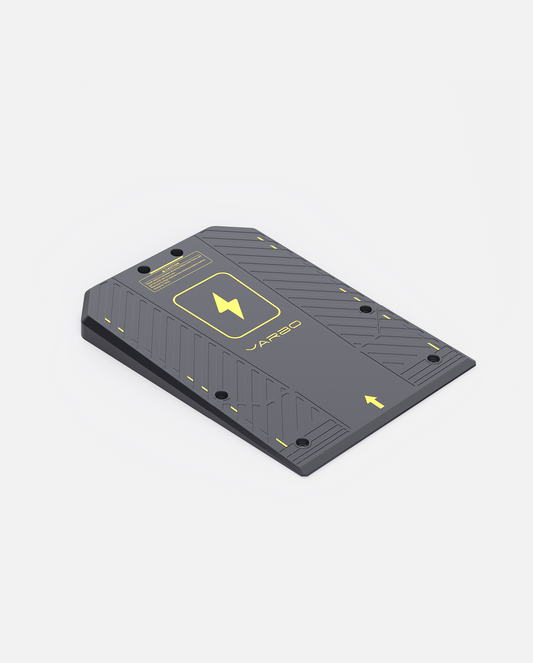 Gray textured docking station with yellow accents and arrow indicators by Jarbo, angled top view showing mounting holes and logo.