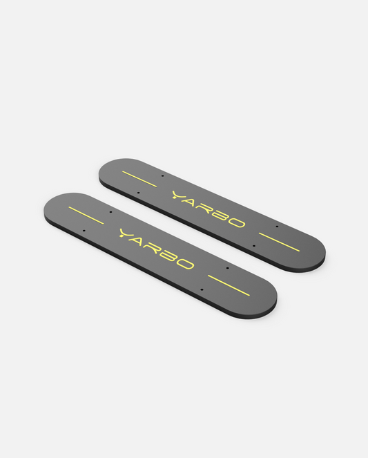 Dark gray weighted side plates with yellow YARBO logo and alignment lines, shown in top-down view.