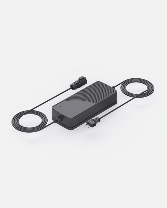 Black wired charger with ribbed texture and coiled cables, shown from top angle on white background
